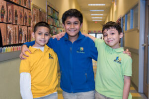 Three male students in NMFA uniforms